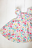 Ruffle twirl dress in Hummingbird Garden